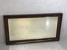 Wooden framed rectangular bevel edged mirror with beaded detailing, approx 98cm x 54cm