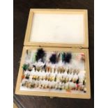 Collection of fishing flies, boxed