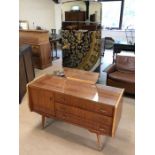 Mid Century high polish dressing table on splayed legs with gold handles, with large bevel edged