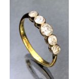 Five stone diamond ring set in Platinum and on a 18ct Gold band size 'O' total weight approx 2.3g