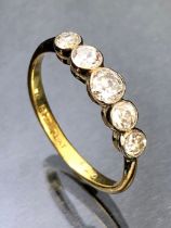 Five stone diamond ring set in Platinum and on a 18ct Gold band size 'O' total weight approx 2.3g