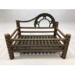 Iron fire grate with cog and chain design, approx 43cm x 31cm x 32cm tall (max)