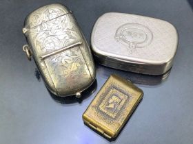 Unusual sovereign and vesta case combined with a brass stamp holder and silver coloured vesta/ snuff