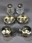 Silver cruets to include two salts, pair of hinge lidded blue glass lined pots and salt and pepper