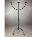 Large floor-standing wrought iron three arm candelabra, individually made in blacksmith's forge,