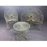 Metalwork vintage garden furniture to include two seater garden bench and armchair with matching