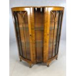 Art Deco serpentine fronted display cabinet with two doors, two glass shelves and curved glass