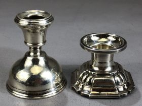 Two Silver squat candlesticks on weighted bases the tallest approx 8cm