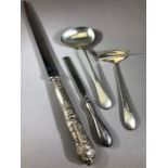 Three hallmarked silver items to include letter opener and baptismal set (4)