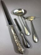 Three hallmarked silver items to include letter opener and baptismal set (4)