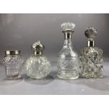 Collection of four cut glass and silver hallmarked collared bottles the tallest approx 18cm