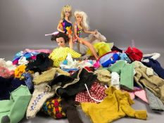 Vintage toys: Two Barbie dolls and a Sindy doll along with a collection of clothing and accessories