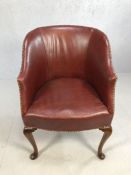 Antique leather club chair with studded detailing on Queen Anne front feet, approx 90cm tall