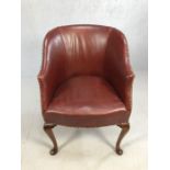 Antique leather club chair with studded detailing on Queen Anne front feet, approx 90cm tall