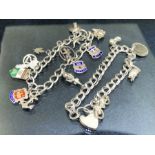 Two Hallmarked Silver charm bracelets with various charms