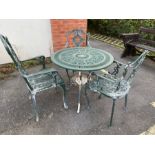 Circular green metal garden table and three chairs