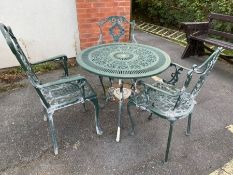 Circular green metal garden table and three chairs
