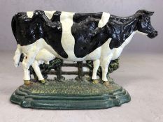 Cast iron door stop in the form of a cow