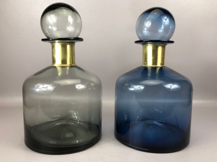 Two large contemporary apothecary-style glass jars with stoppers, each approx 38cm in height