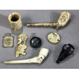 Interesting collection of curios to include an early scrimshaw figure, two vintage clay pipes, one