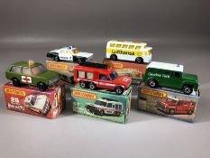 Five boxed Matchbox diecast model vehicles: Superfast 10 Plymouth Police Car, Rola-matics 20