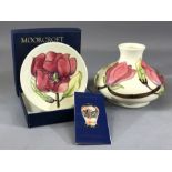 MOORCROFT squat baluster pink magnolia pattern vase, height approx 10cm, and a boxed circular pink