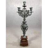 Five branch metal candelabra on stepped marble base, approx 64cm tall