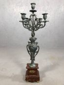 Five branch metal candelabra on stepped marble base, approx 64cm tall
