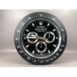 Black contemporary Rolex-style wall clock, approx 34cm in diameter