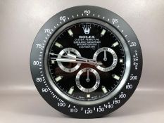 Black contemporary Rolex-style wall clock, approx 34cm in diameter