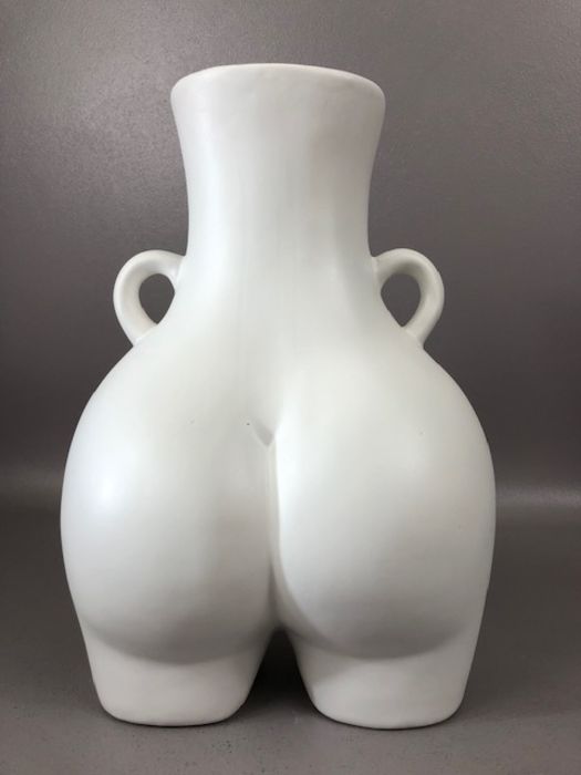 Modern ceramics: a white vase in the form of a posterior, with twin handles, approx 30cm in height