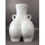 Modern ceramics: a white vase in the form of a posterior, with twin handles, approx 30cm in height