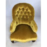 Antique fabric button back chair with original castors, approx 88cm tall