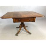 Pembroke table on four splayed legs with lion paw brass feet and original castors