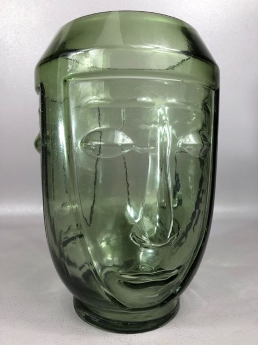 Contemporary green vase with face design to sides, approx 28cm in height