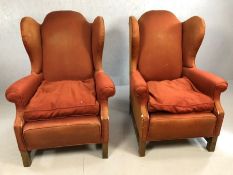 Pair of red fabric vintage wingback armchairs (A/F)