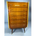Mid Century high polish flight of six drawers on splayed legs with gold handles, approx 72cm x