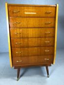Mid Century high polish flight of six drawers on splayed legs with gold handles, approx 72cm x