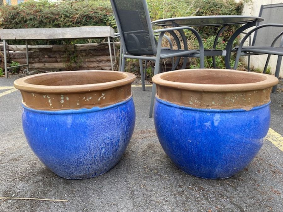 Two large blue terracotta glazed garden planters, approx 48cm in diameter