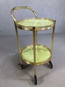 Vintage gold coloured circular tea trolley on wheels