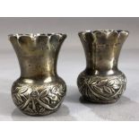 Pair of Victorian flared rimmed vases with repousse floral decoration approx 6.5cm tall by maker