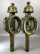 Pair of Brass Coaching Oil lamps with red glass to reverse and ornate chimneys approx 45cm tall