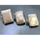 Three silver hallmarked vesta cases two with decoration