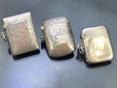 Three silver hallmarked vesta cases two with decoration