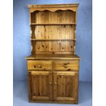 Small Pine dresser with shelves over and cupboards and drawers under, approx 96cm x 46cm x 183cm