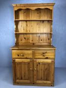 Small Pine dresser with shelves over and cupboards and drawers under, approx 96cm x 46cm x 183cm