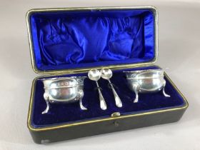 Silver hallmarked cruet set. Two salts with blue glass liners and two spoons all with matching