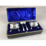 Silver hallmarked cruet set. Two salts with blue glass liners and two spoons all with matching