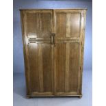 Carved wood double wardrobe with hanging rails, hooks and single shelf. Approx 118cm x 53cm x 180