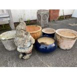 Collection of garden plant pots and a gnome